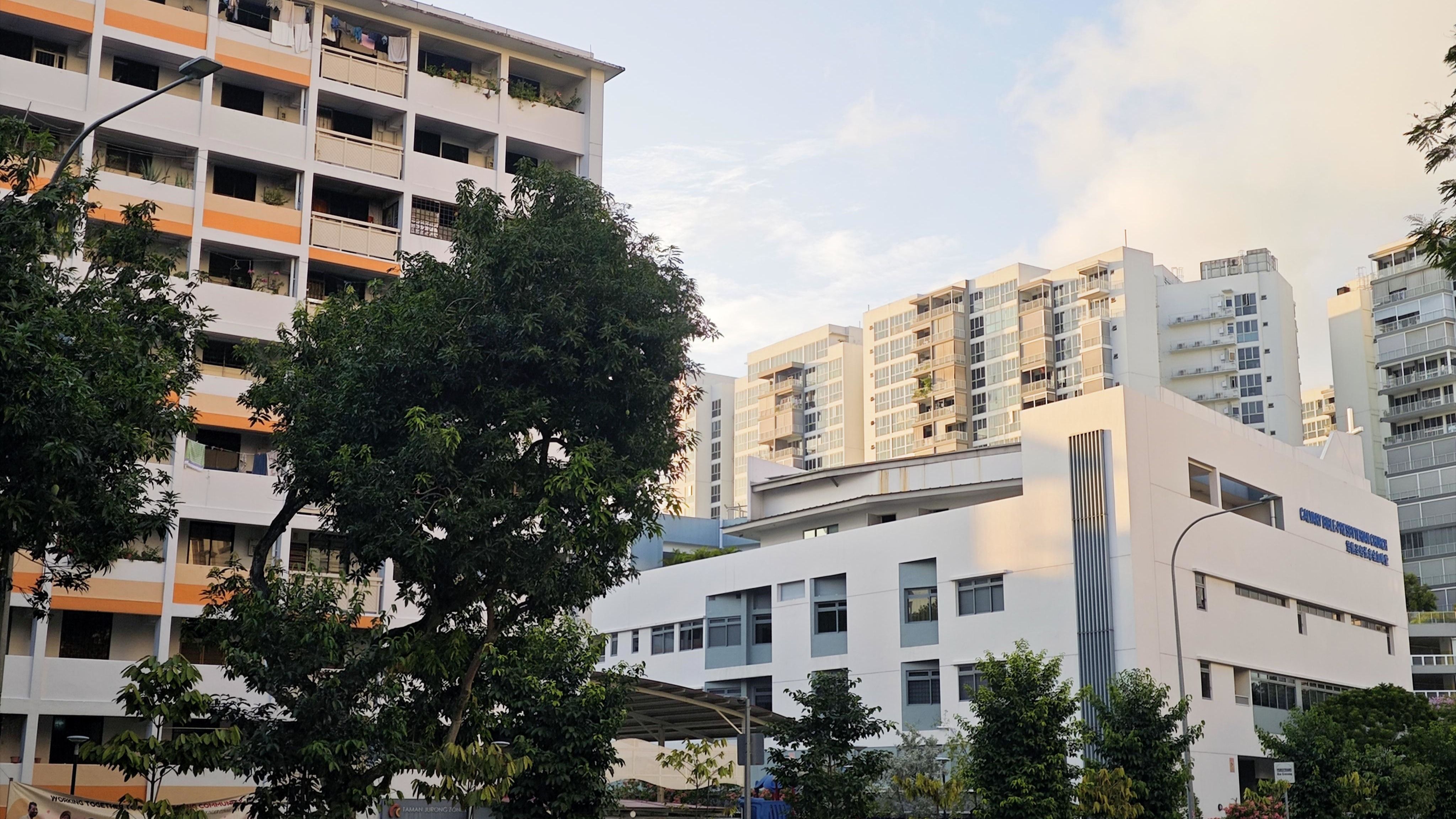 An HDB rental block, a private condominium, and a church standing in between