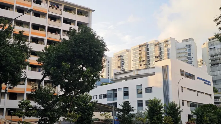 An HDB rental block, a private condominium, and a church standing in between
